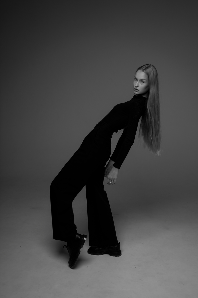 Black and White Photo of Woman in Black Turtleneck