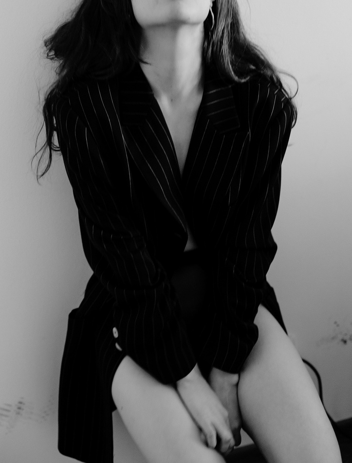 Woman in Black and White Striped Blazer