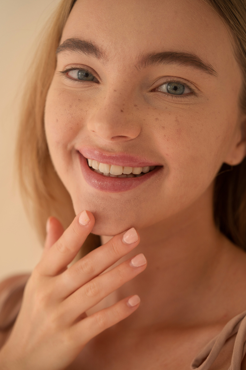 Smiling Woman Touching Her Chin