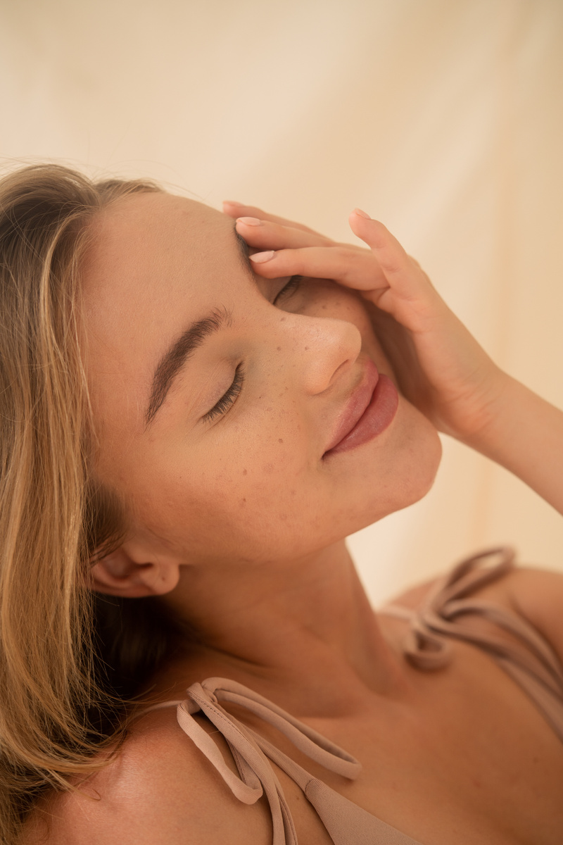 Woman Touching Her Face